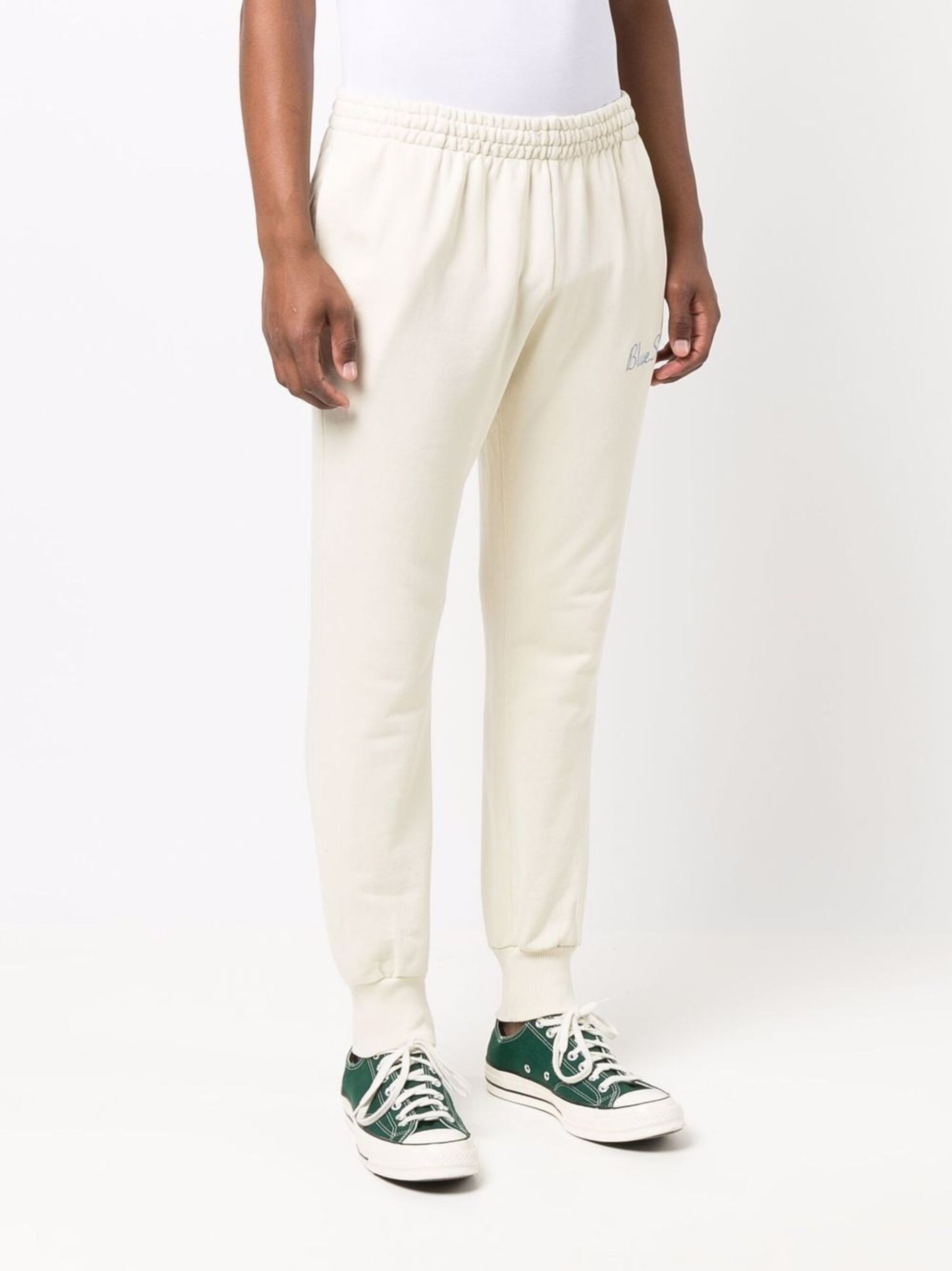 Pantalones deportivos con logotipo en color crema