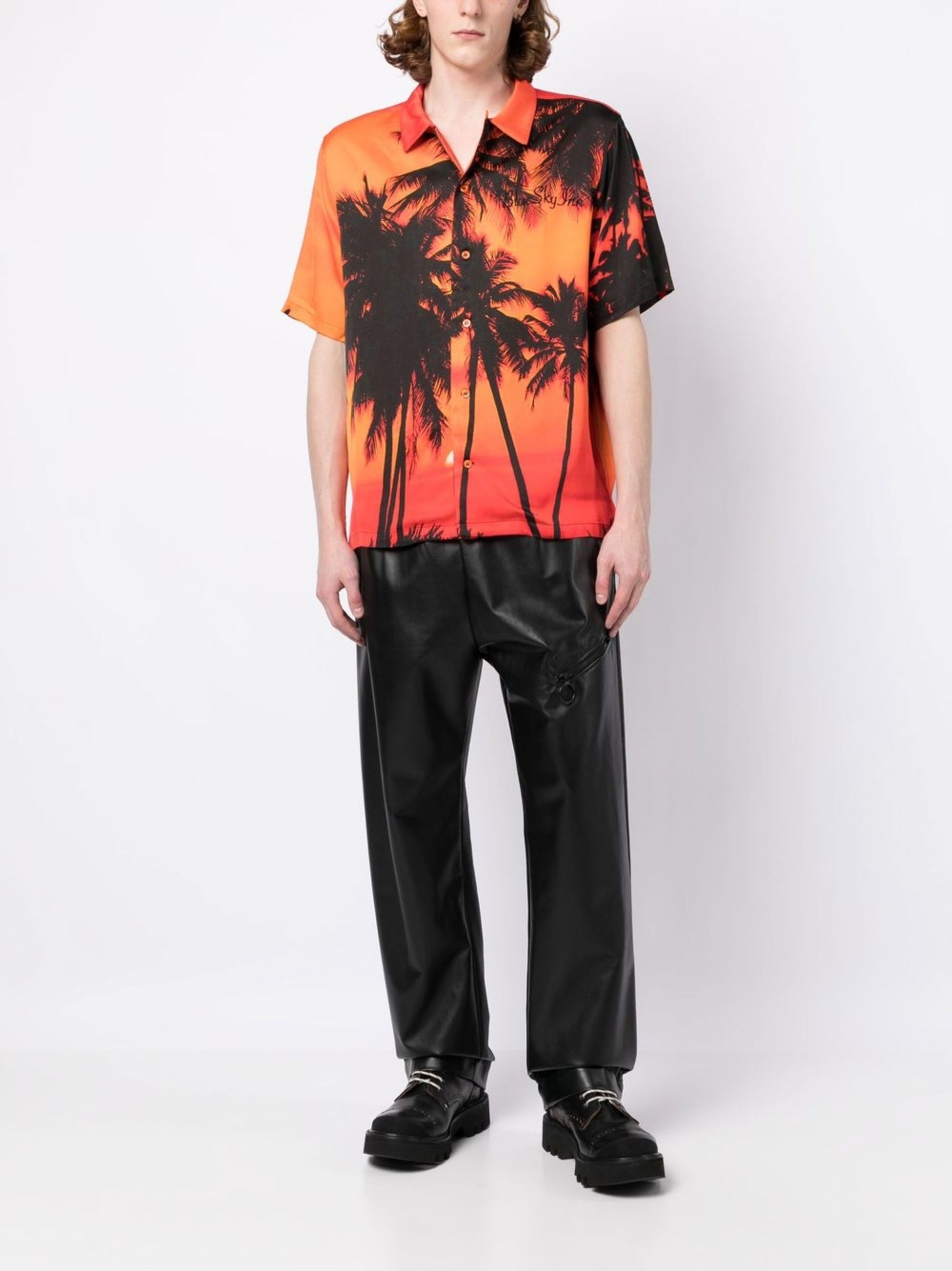 Camiseta con palmeras al atardecer