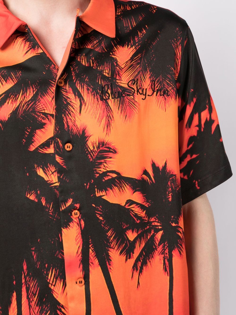 Camiseta con palmeras al atardecer