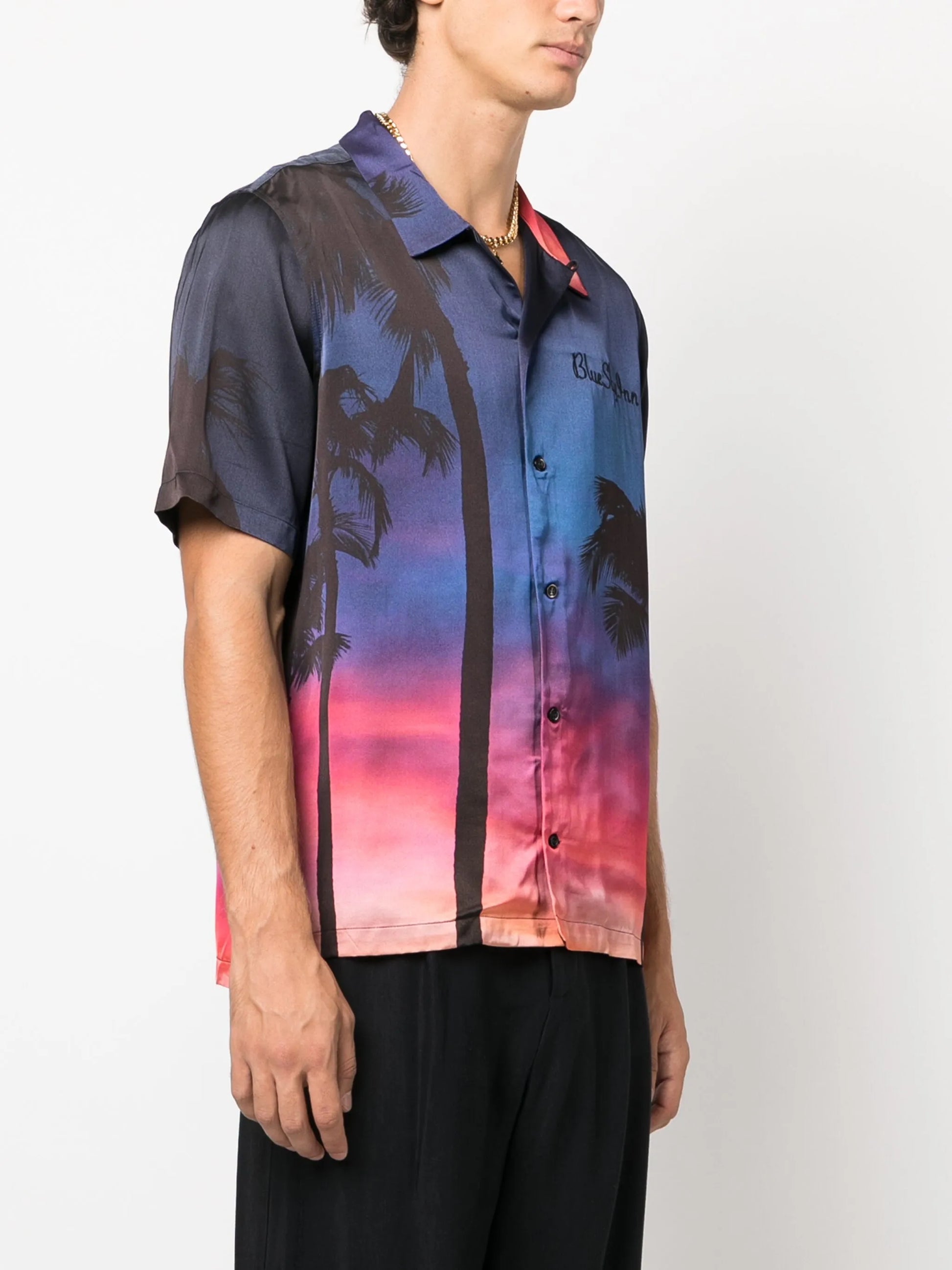 Camiseta con palmeras al atardecer