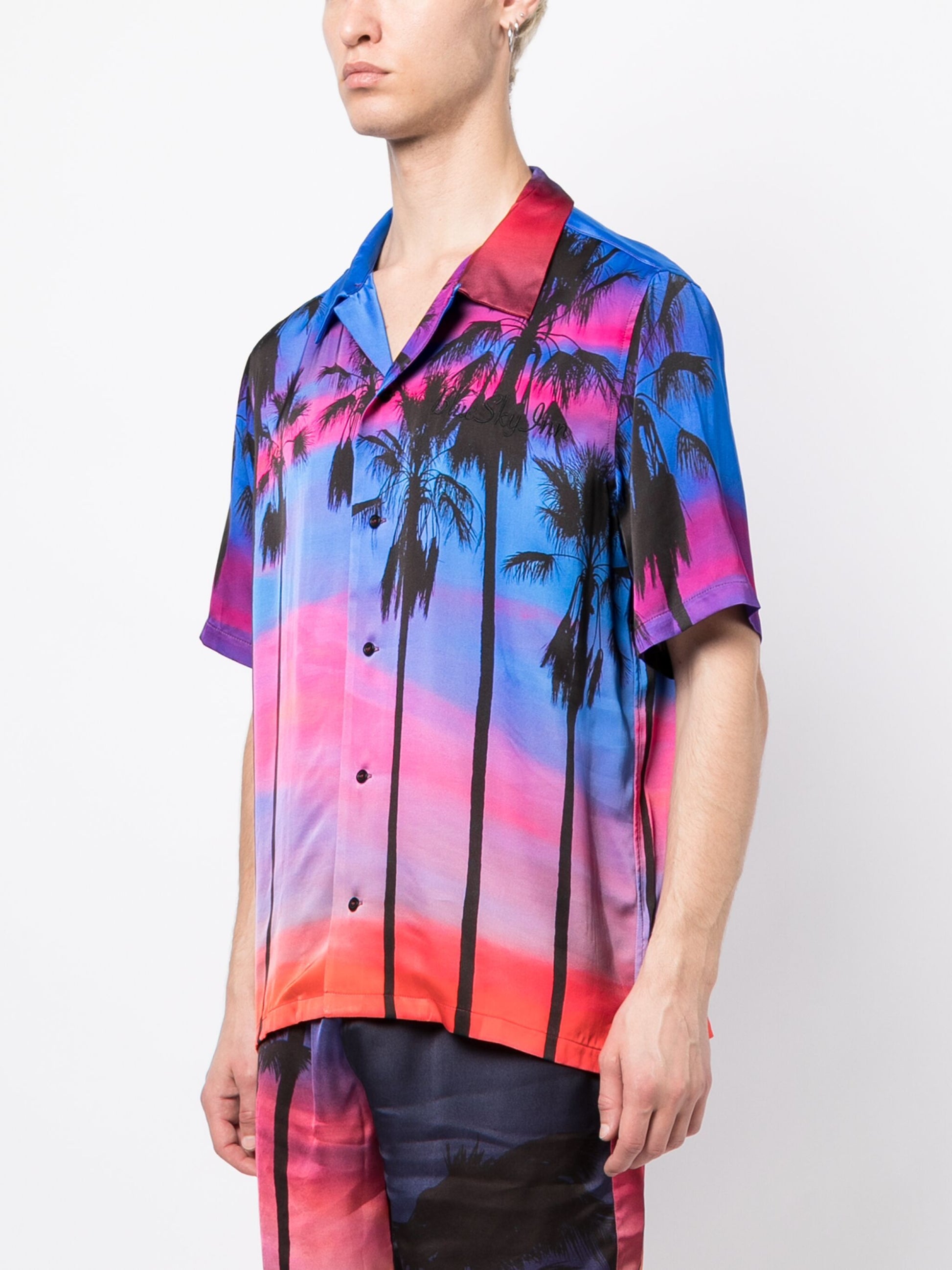 Camiseta con palmeras al atardecer