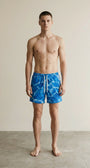 Full body view of the model wearing Swim Trunks