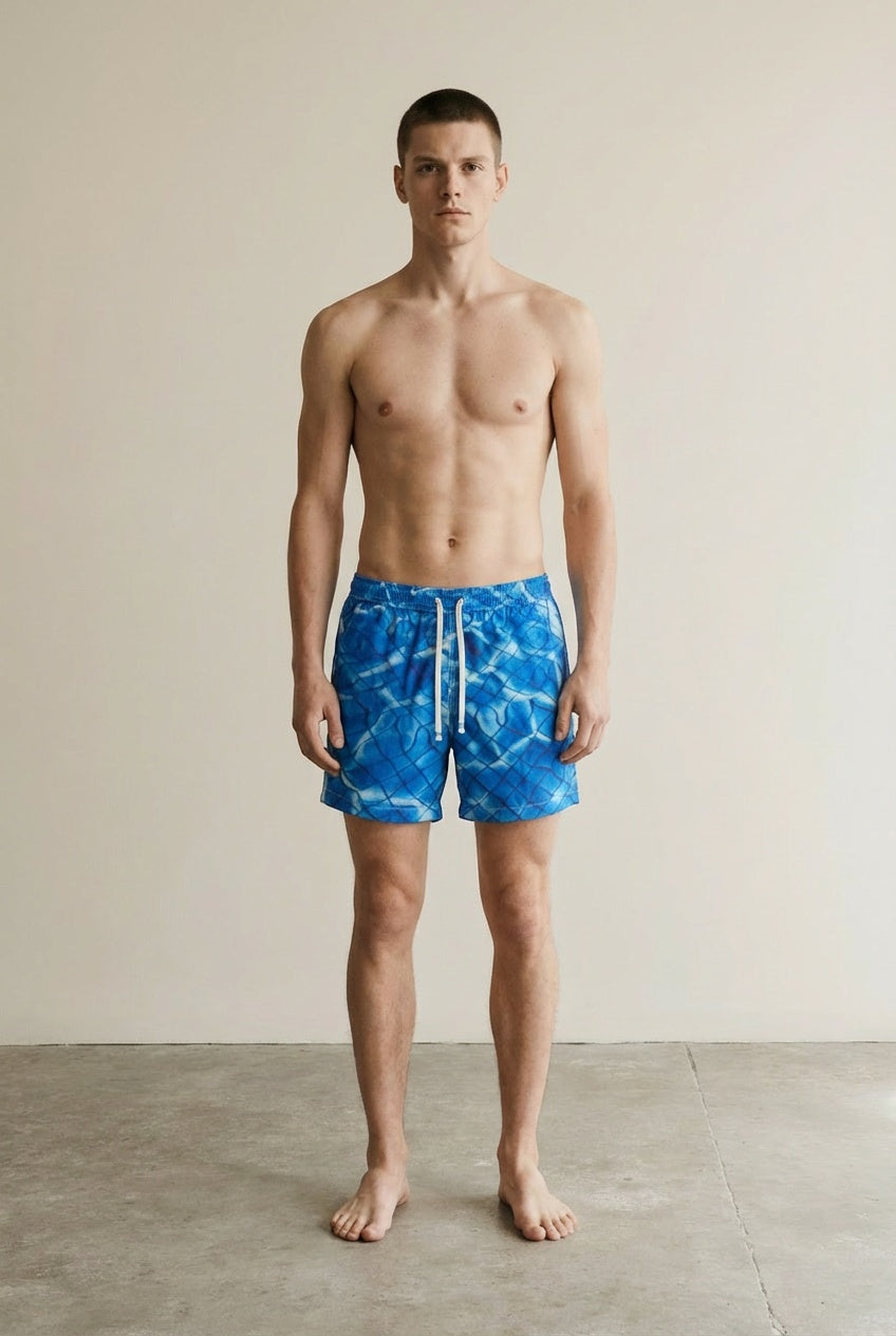 Full body view of the model wearing Swim Trunks