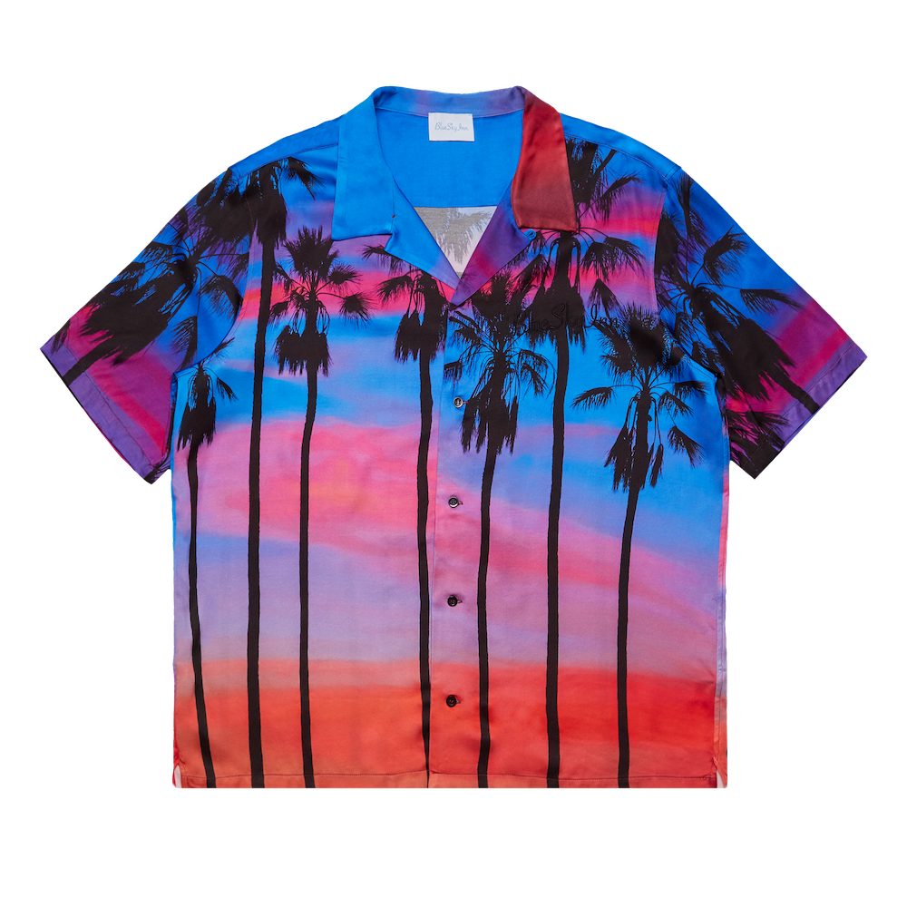 Camiseta con palmeras al atardecer