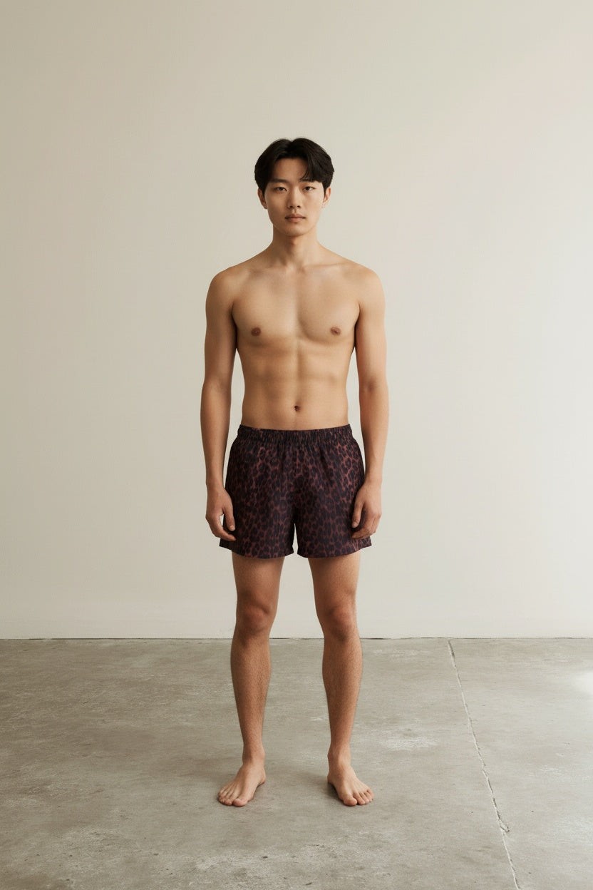 Full body view of the model wearing Leopard Logo Swim Shorts